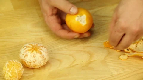 Hands clean mandarins Stock Footage 67584599