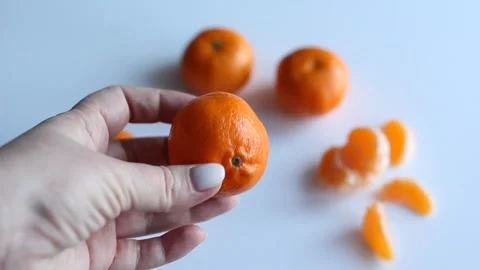Hands clean tangerine Stock Footage 168935159