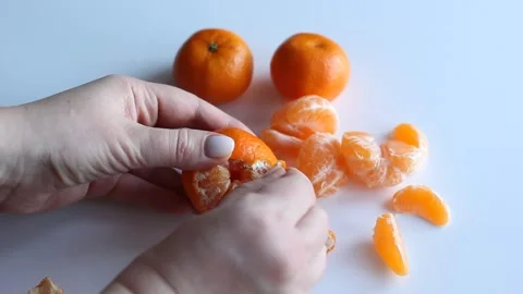 Hands clean tangerine. Stock Footage 168935208