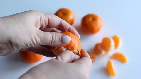 Hands clean tangerine Stock Footage 168935212