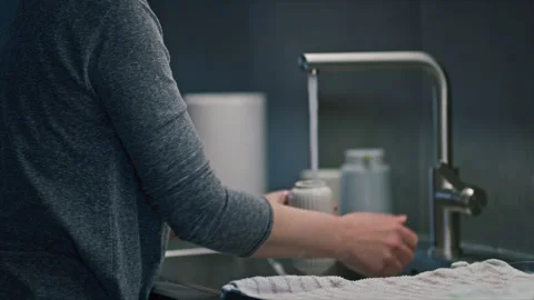 Hands cleaning kitchenware under running water, home hygiene and daily hous.. Stock Footage 344579145