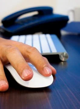 Hands clicking computer mouse Stock Photos