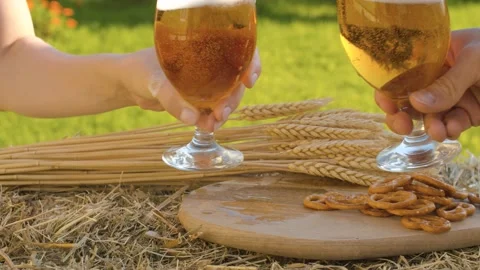Hands clinking glasses with beer Stock Footage 141600469