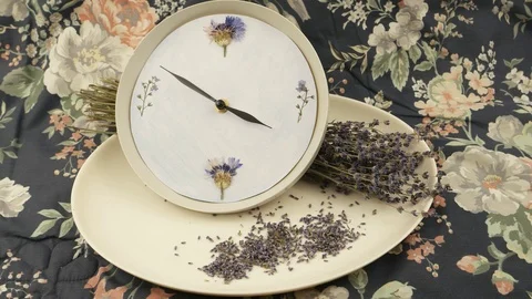 The hands of the clock move on the dial of the decorative clock Stock Footage 93414395