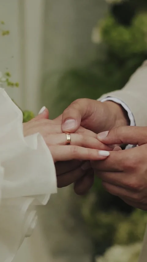 Hands close-up, bride and groom holding hands and exchanging wedding rings Stock Footage 306580666