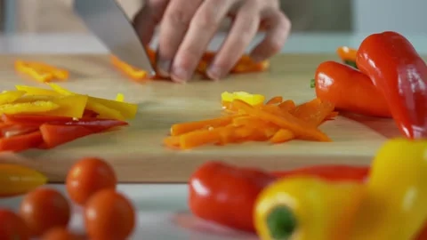 Hands close up cutting peppers Stock Footage 132602435