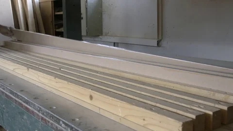 Hands close up of joiner during putting painted planks into the hydraulic press. 動画素材 80018067