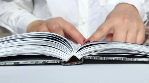 Hands close a printed thick book. Stock Footage 311992445