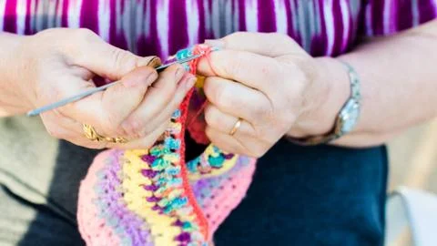 Hands close-up view of an old lady knitting on knitting needles Stock Photos