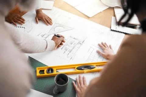 Hands, collaboration and construction with a building team working in their Stock Photos