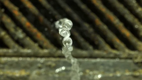 Hands that collect water coming down from a fountain Video stock 77764887