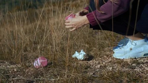 Hands collecting garbage pollution from grass. Stock Footage 218470707
