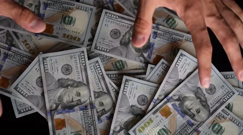 Hands Collecting Stack of Hundreds of Dollars Close Up. Stock Footage 66681060
