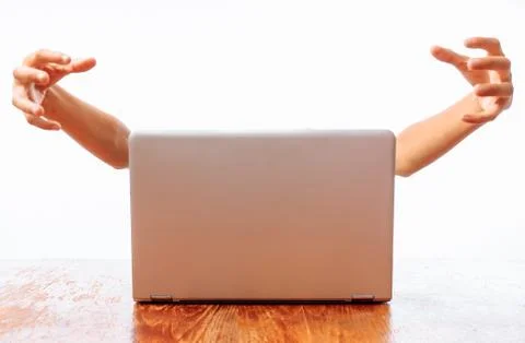 Hands that come out of the computer, the concept: the Internet or the compute Stock Photos