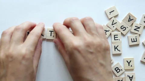 Hands composing word maths from wooden letters on white background Stock Footage 157679526