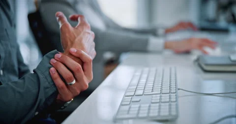 Hands, computer and employee with wrist pain in office, coworking and overworked Stock Footage 336306129