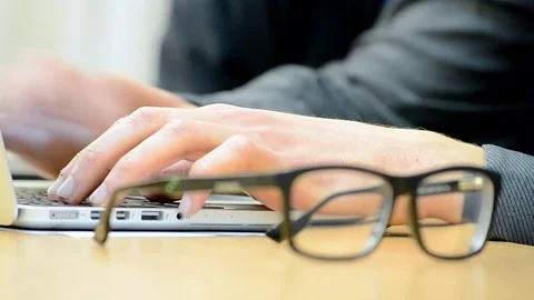 Hands, computer and glasses. Stock Footage 71010872
