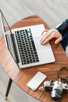 Hands on the computer keyboard , cozy working place Stock Photos