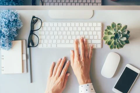 Hands on a computer keyboard Stock Photos