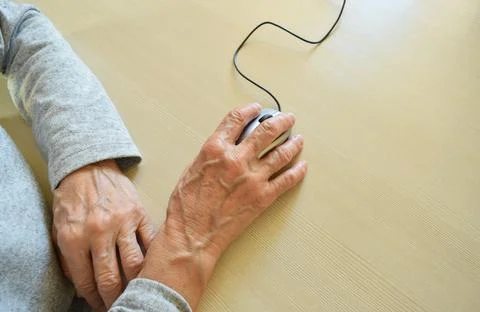 Hands on computer mouse Stock Photos