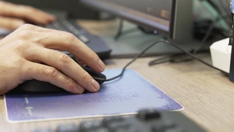 Hands with a computer mouse. The work of an IT specialist. Stock Footage 252664096
