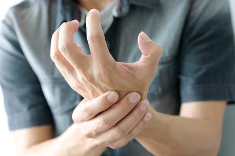 Hands of computer users have pain and injury to the fingers. From Syndrome Sy Stock Photos