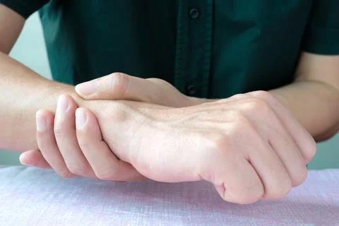 Hands of computer users have pain and injury to the fingers. From Syndrome Sy Stock Photos