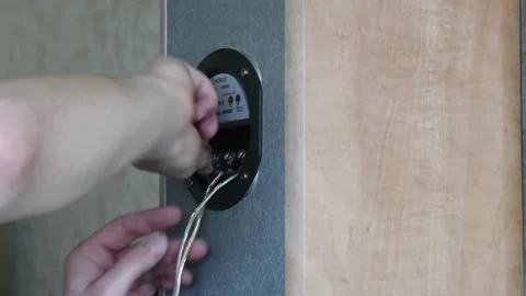 Hands connect copper aluminum cables to speakers Stock-Footage 166923906