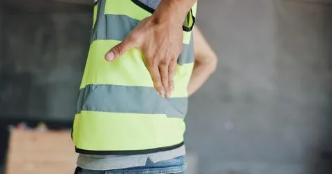 Hands, construction worker and back pain for renovation, project and exhausted Stock Photos