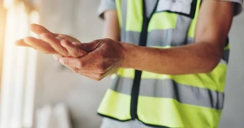 Hands, construction worker and pain with carpal tunnel for renovation project Stock Photos