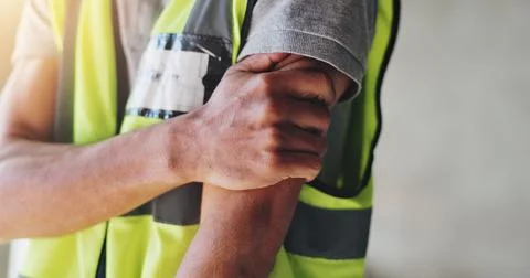 Hands, construction worker and shoulder pain for renovation, project and Stock Photos
