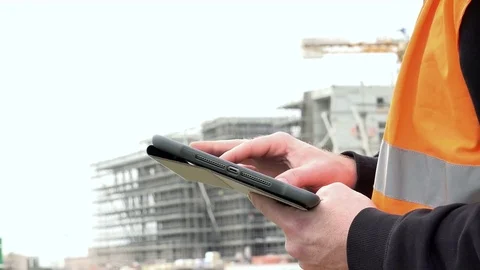 Hands of construction workers flowing tablet Stock Footage 72410636