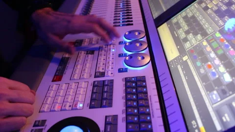 The hands control on the light console Stock Footage 231574127