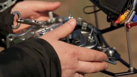 The hands on the control panel are controlled by a copter. Stock Footage 75863153
