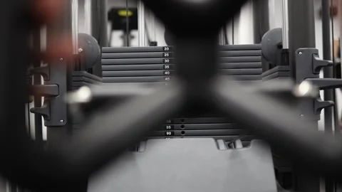 Hands control rowing handle during focused strength exercise Stock Footage 337346714