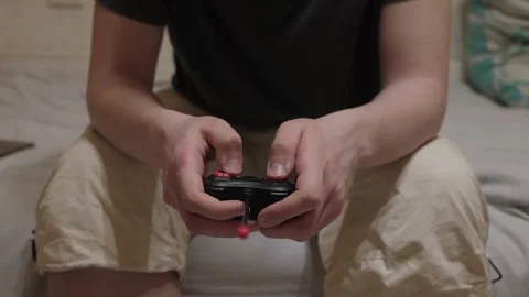 Hands on controller cozy bedroom gaming Stockbeeldmateriaal 328256179