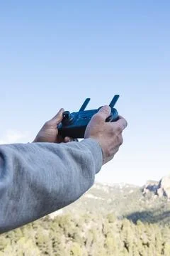 Hands on controller flying drone Stock Photos