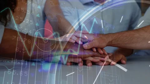 Hands converging and stacking on tabletop, overlay shifting while signaling team Stock Footage 328384483