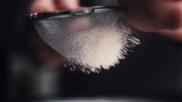 Hands of cook adding powdered sugar on the peice pie Stock-Footage 85851758
