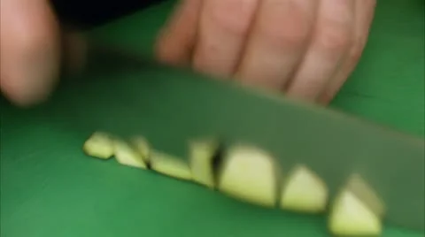 The hands of a cook chopping vegetables in a restaurant kitchen Stock Footage 11286064