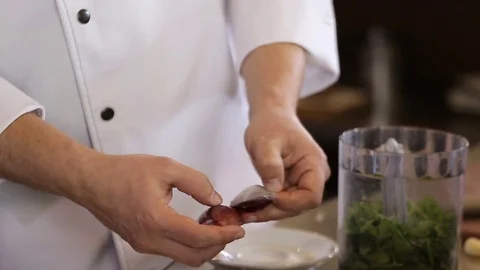 Hands of the cook cleaned bow Stock Footage 74716024