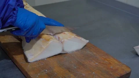 The hands of the cook cut the fish Stock Footage 148463239