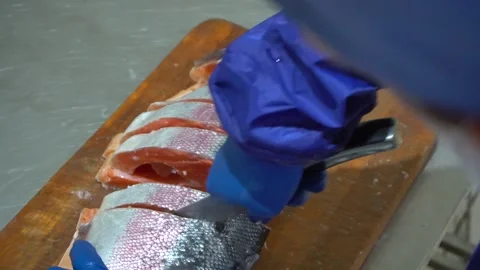 The hands of the cook cut the fish Stock Footage 148463820