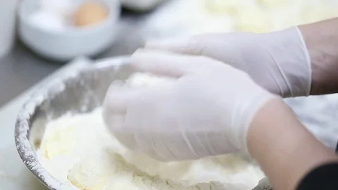 The hands of the cook in flour Stock Footage 76082405