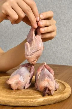 Hands cooking quails Stock Photos