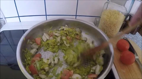 Hands cooking vegetable ragout in pan in kitchen Stock Footage 47591920