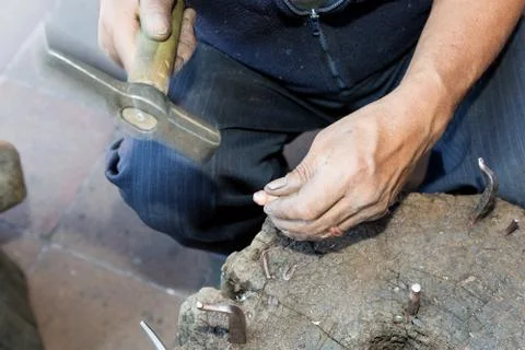 Hands of a coppersmith Fotos de archivo