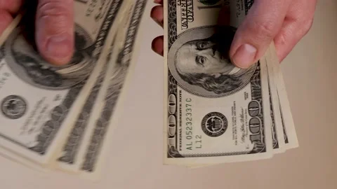 Hands count american dollar banknotes money on a light background. Capital inves Video stock 221651308