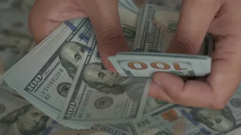 Hands count dollar bills on the money background. Video stock 161189708