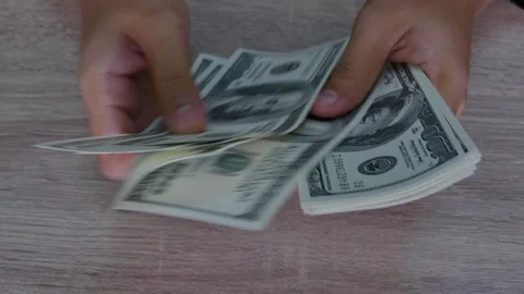 Hands count dollar bills on the table Stock Footage 160562120